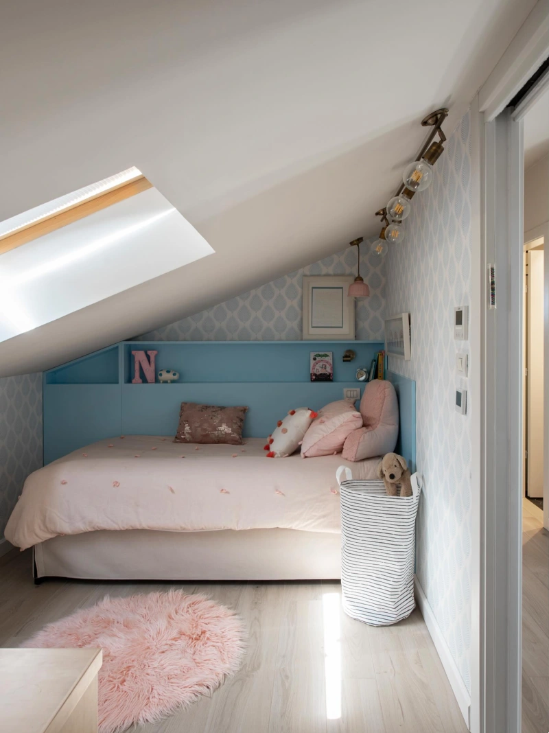 Light Blue Storage Headboard Ledge with Pink Bedding and Large Skylight