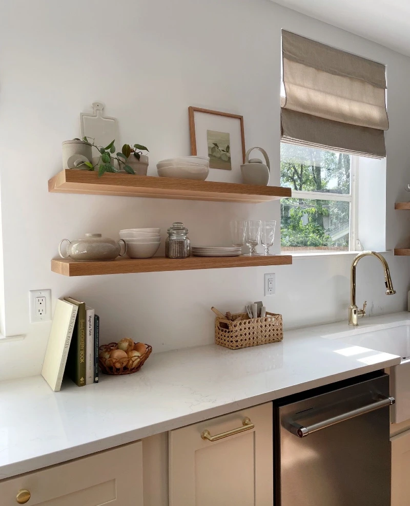 Light Oak Floating Shelves with Matte Ceramics, Framed Still-Life Art, and a Ceramic Teapot