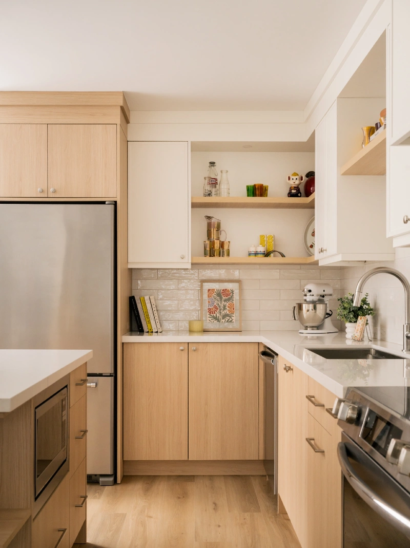 Light Wood Kitchen Corner with Open Shelves, Stand Mixer, and Framed Botanical Art