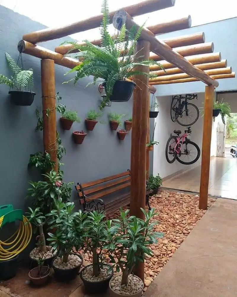 Log Pergola with Hanging Ferns and Terracotta Wall Planters