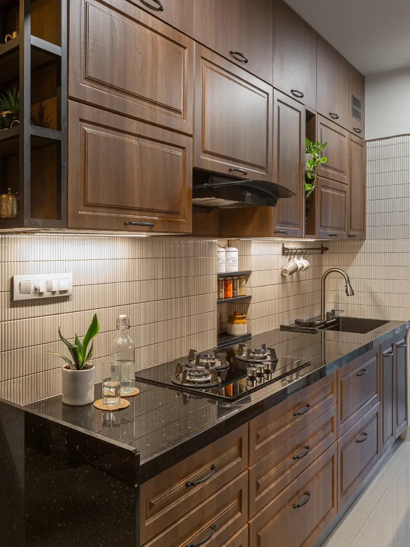 Mid-Century Walnut Cabinetry With Polished Black Granite Counters and Vertical Kit Kat Backsplash