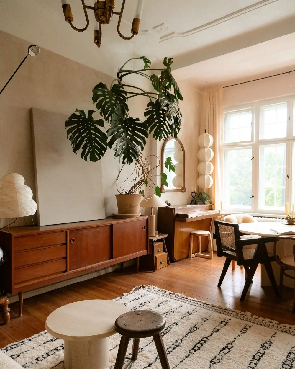 Mid-Century Wooden Sideboard with Monstera and Sunlit Dining Corner