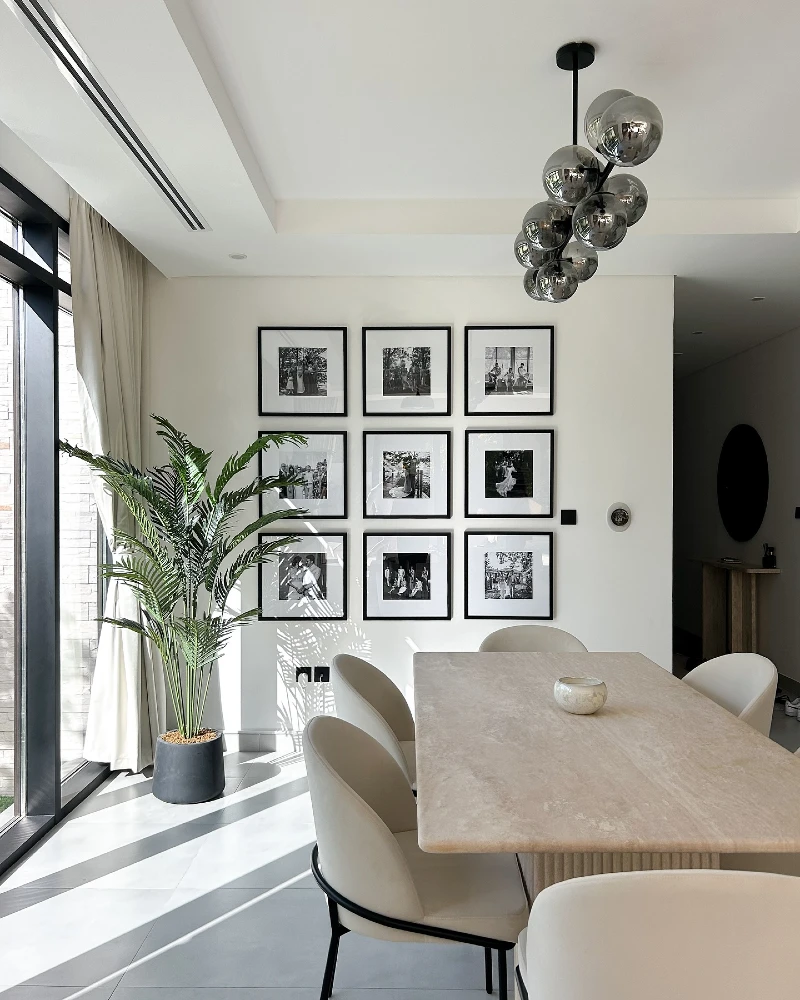 Minimal Black Frame Grid Gallery Wall with Monochrome Portrait Focus