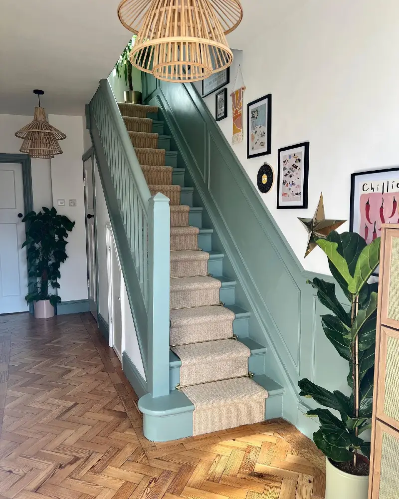 Mint Green Wainscoting and Matching Staircase with Woven Runner and Rattan Pendants