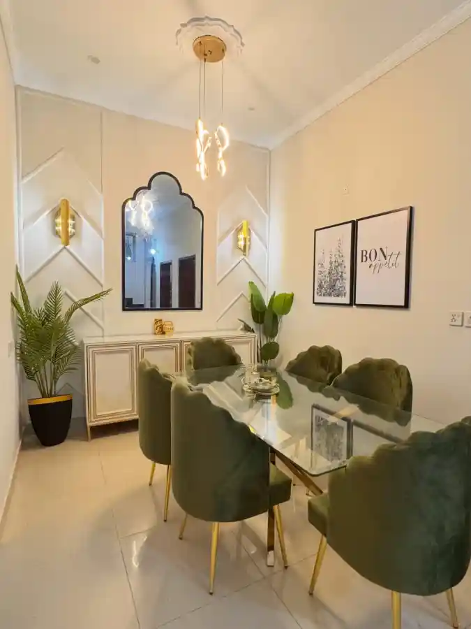 Modern Glass Dining Table with Green Velvet Chairs