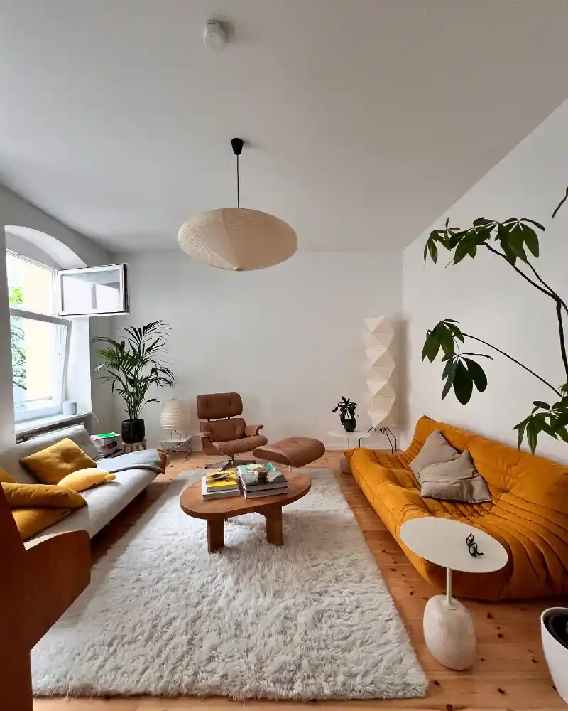 Mustard Tufted Sofa with Shaggy Rug and Paper Lanterns