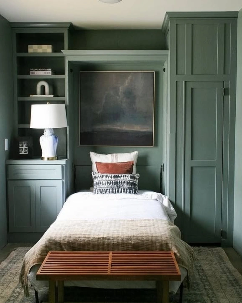 Muted Sage Twin Wall Bed with Moody Landscape Art and Slatted Wood Bench