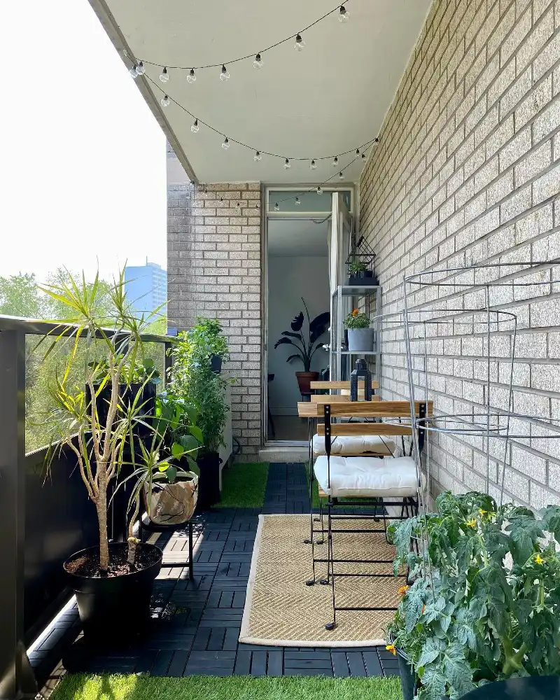 Narrow Brick Balcony with Vertical Garden Wall and Minimal Bistro Seating