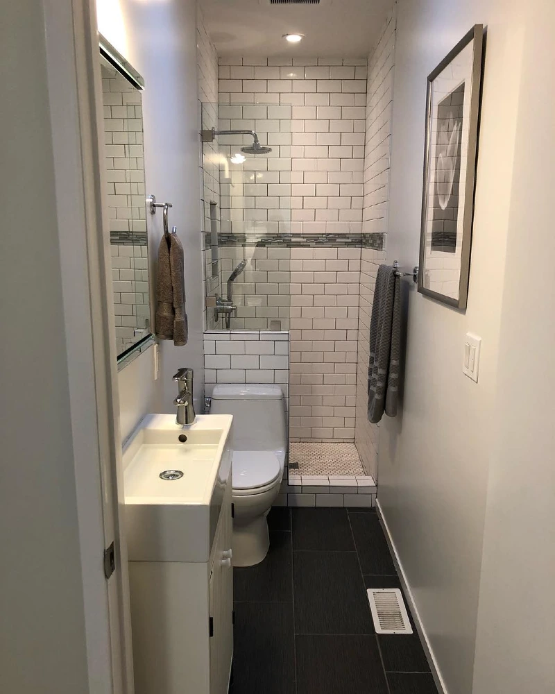 Narrow White Subway Tile Shower with Slim Vanity and Charcoal Floor Tiles