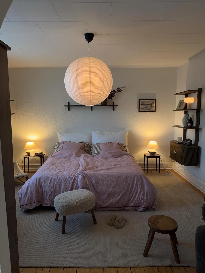 Paper Lantern Bedroom with Soft Pink Bedding and Symmetrical Bedside Glow
