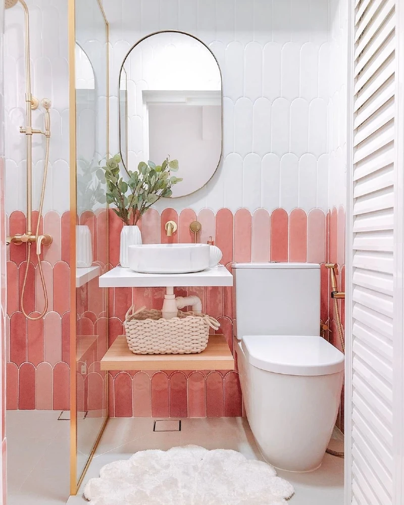 Pink and White Scalloped Wall Tiles with Gold Fixtures and Floating Console Shelf