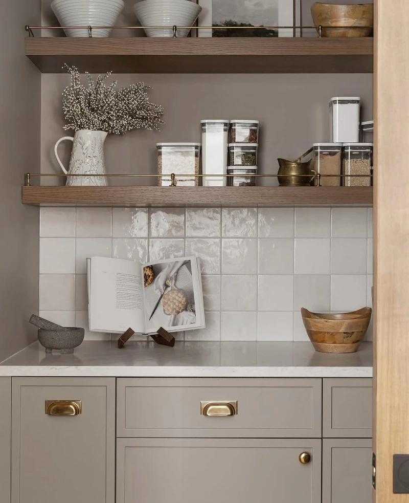Plate-Rail Wooden Shelves with White Ceramic Bowls, Art, and Acrylic Canisters