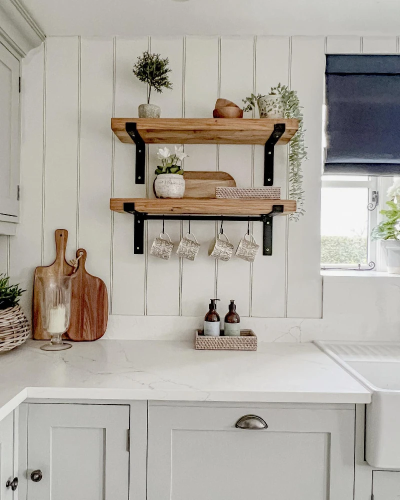 Reclaimed Wood Shelves with Matte Pottery, Hanging Mugs, and Vertically Grooved Shiplap