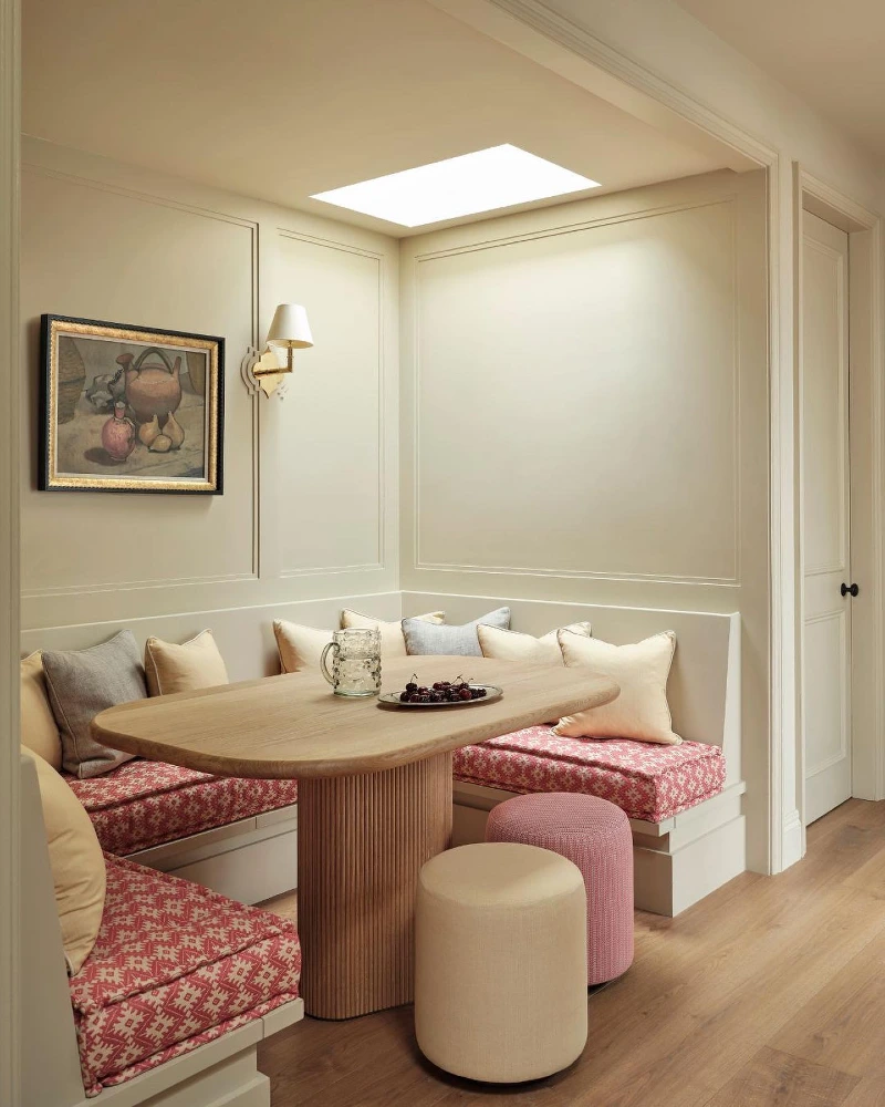 Red Pattern Banquette with Fluted Wood Table and Soft Pouf Seating