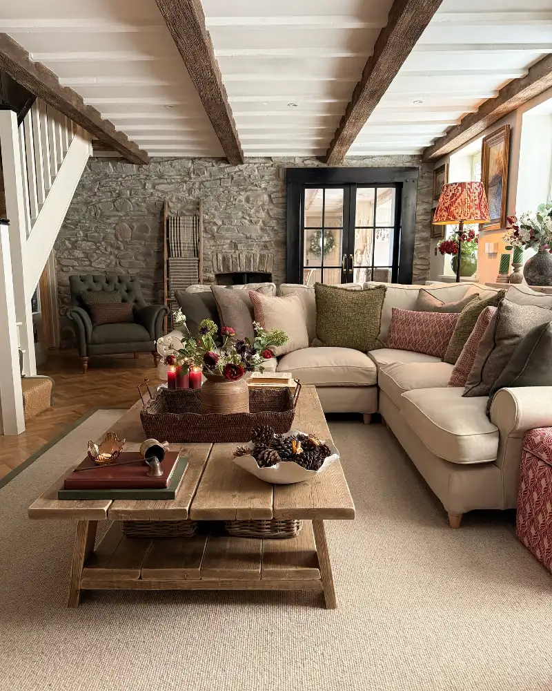 Rustic Beam Living Room with Stone Wall and Layered Pillows