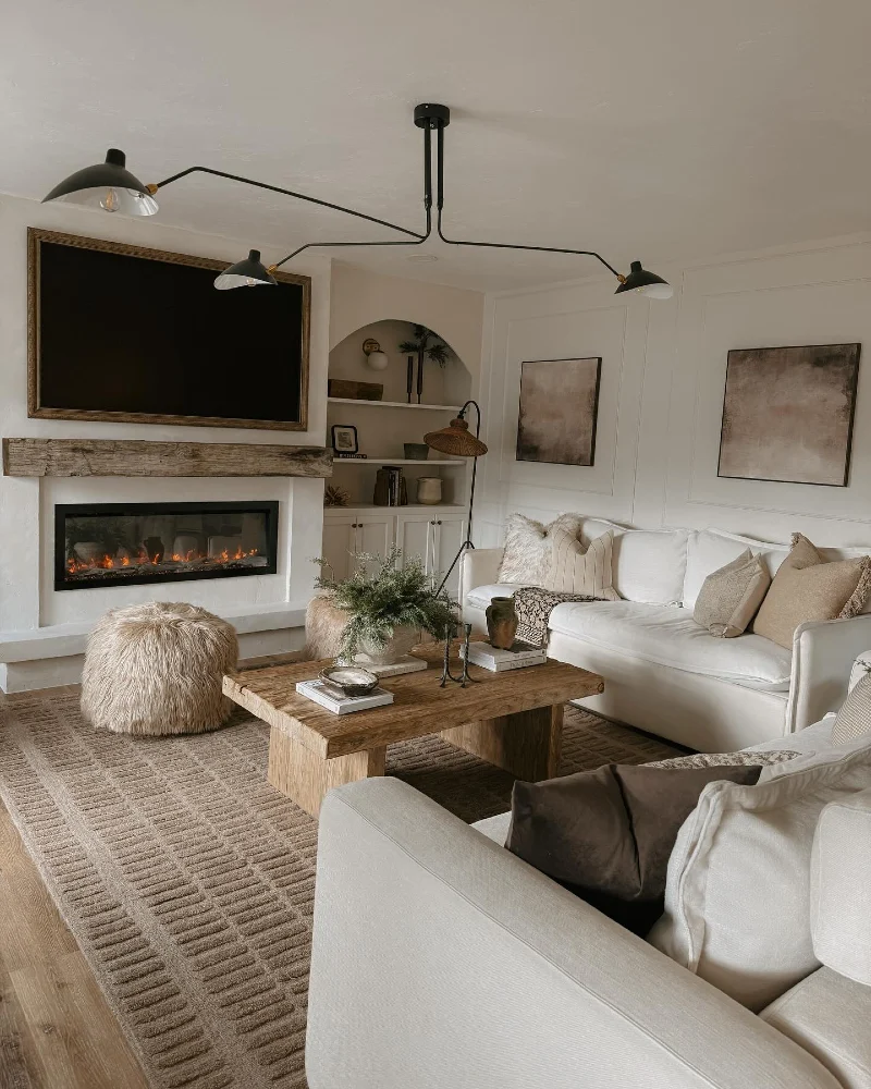 Rustic Wood Mantel with Cream Sofas and Black Branch Chandelier
