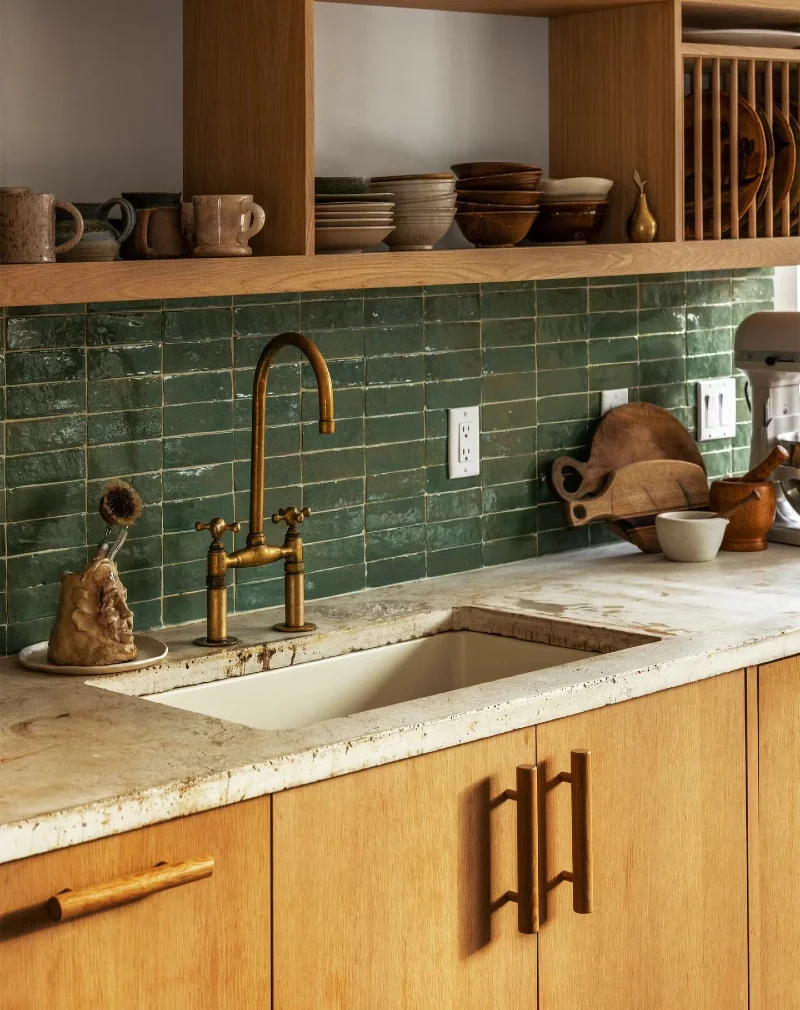 Rustic Wood Shelf Kitchen with Handmade Green Tile Backsplash and Brass Faucet