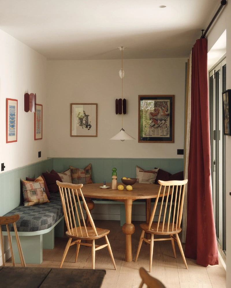 Sage Bench Nook with Round Wood Table and Rust Curtain