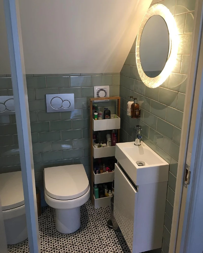Sage Green Glossy Subway Tiles with Sloped Ceiling and Slim White Vanity Nook