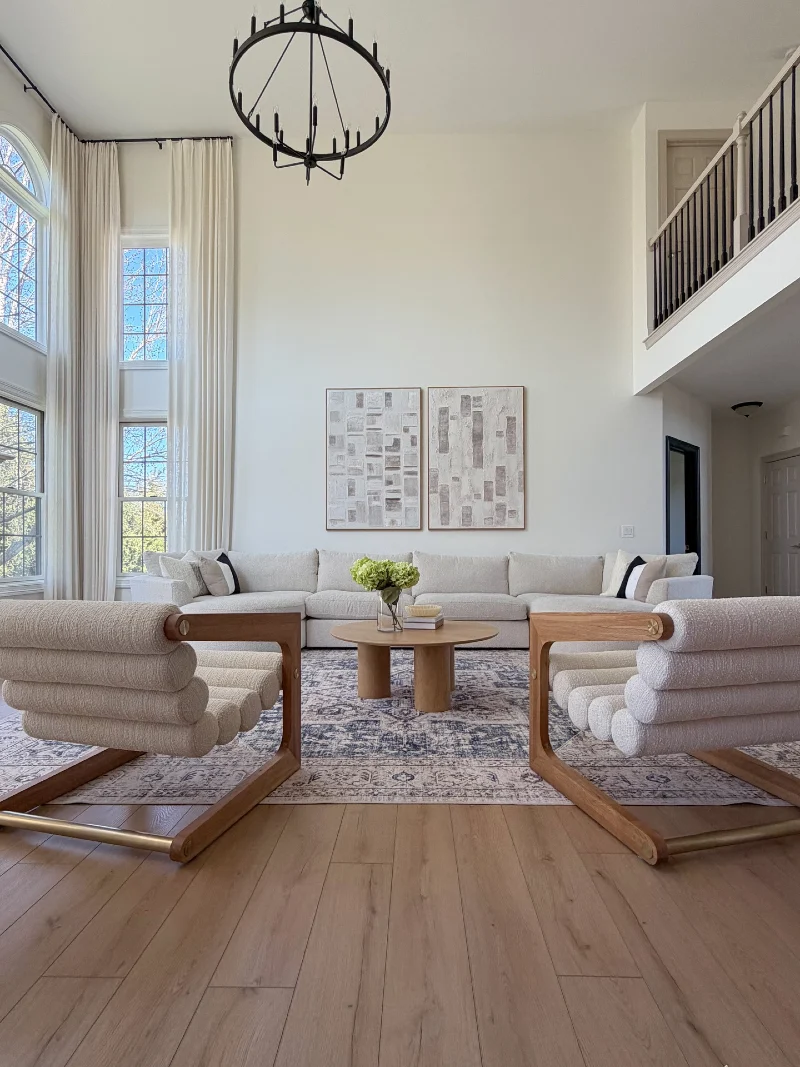 Sculptural Brass Chandelier Over Clean Old-Money Gallery Lounge