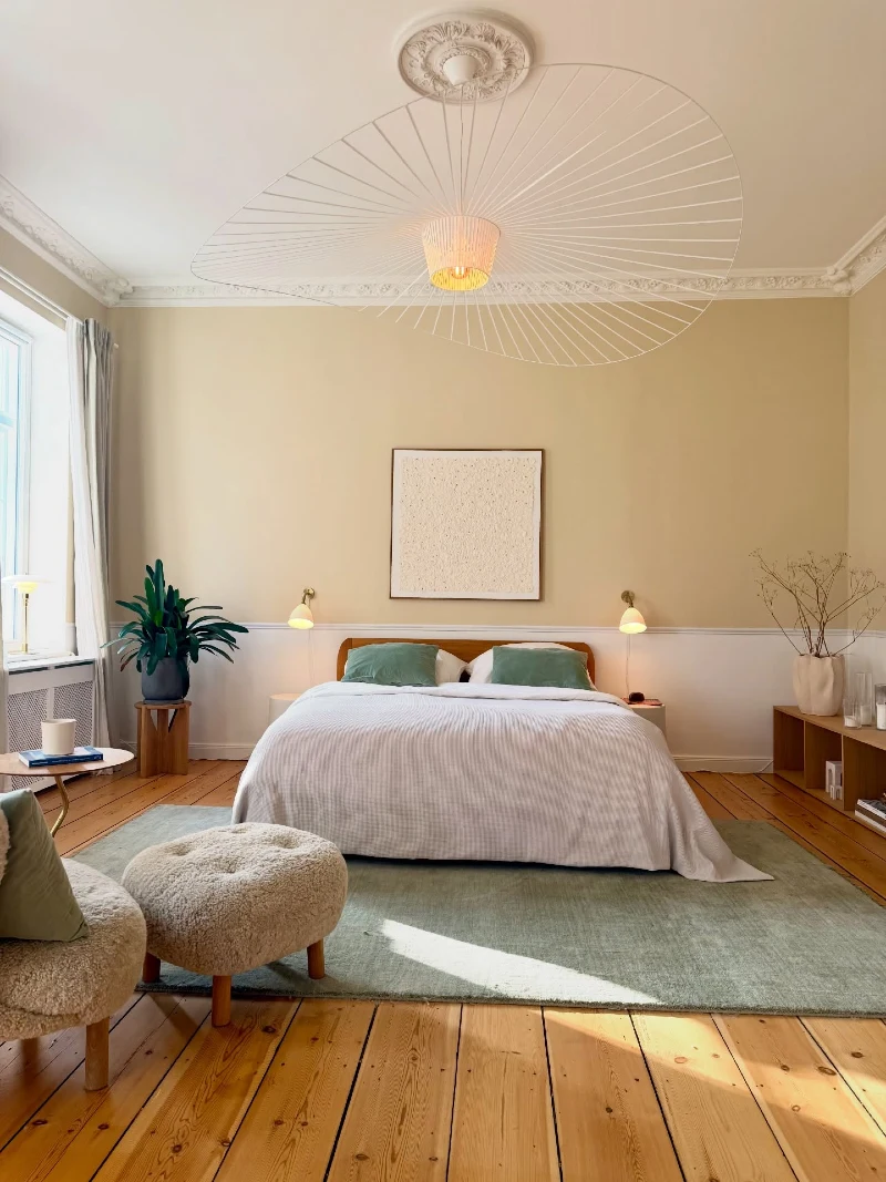 Sculptural Ceiling Light Over Warm Neutral Scandinavian Bedroom