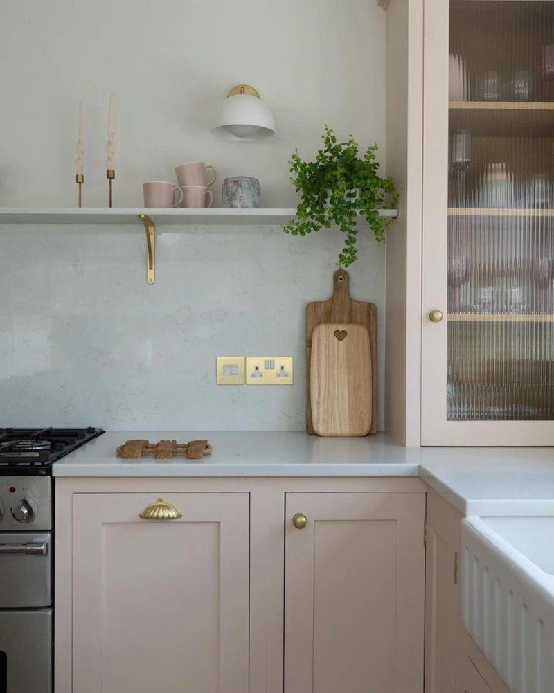 Slim White Bracket Shelf with Pastel Mugs, Taper Candles, and a Fluted Glass Upper Cabinet