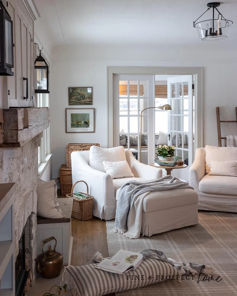 Slipcovered Chairs Around a Stone Fireplace