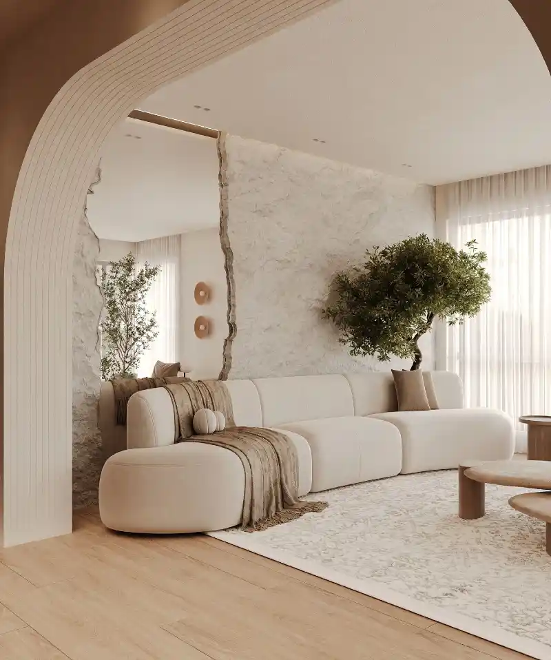 Stone Accent Wall with Fluted Archway and Curved Sectional