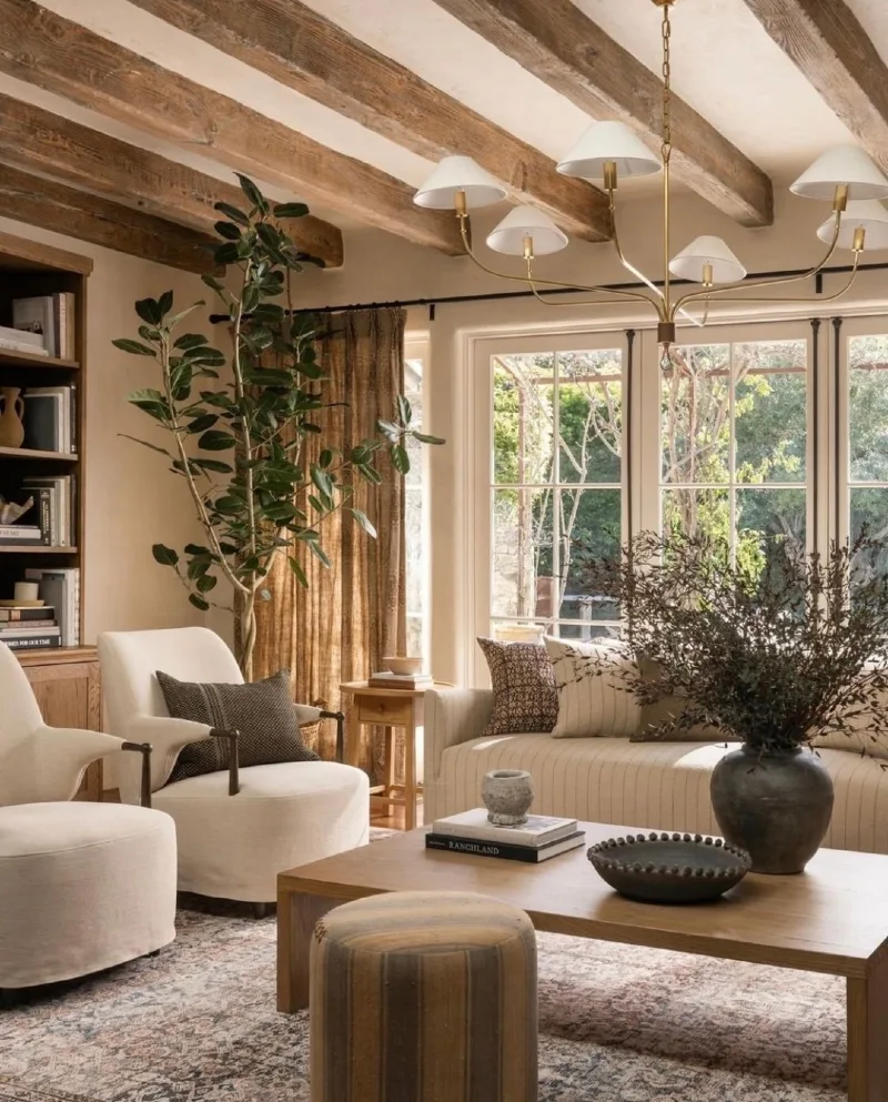 Sunlit Beam Living Room with Cream Barrel Chairs