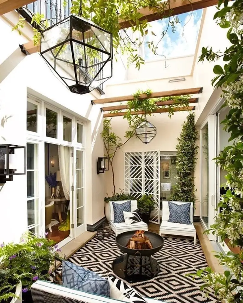 Sunlit Courtyard with Geometric Rug and Fire Bowl