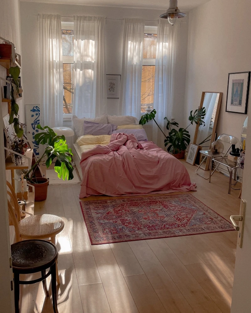 Sunlit Pink Bedding Bedroom with Sheer Curtains and Persian Rug Layers