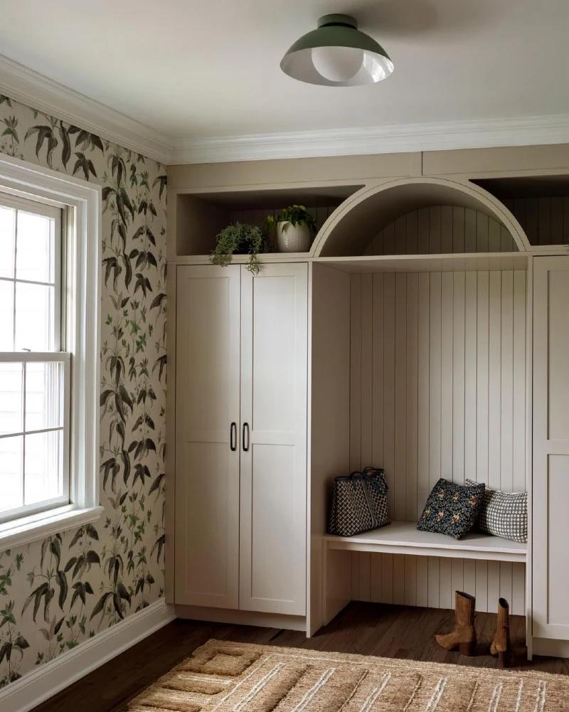 Taupe Built-In Unit with Arched Cubby Detail and Botanical Wallpaper