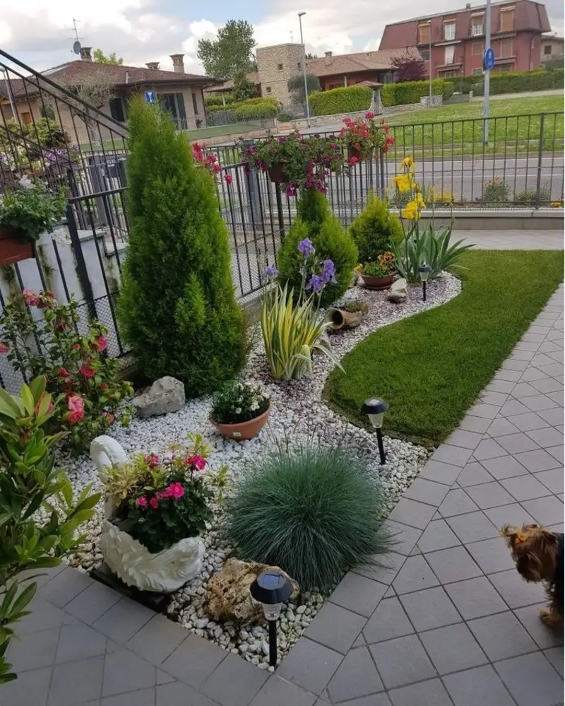 Tiered White Gravel Border with Conifers and Swan Planter