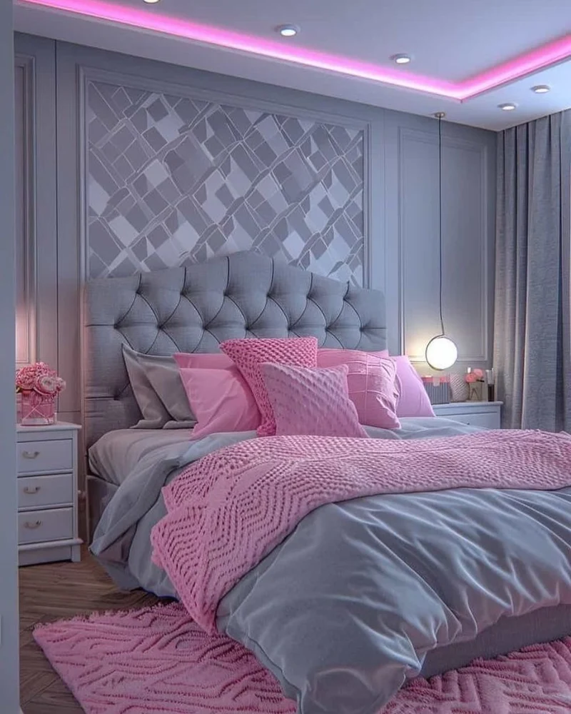 Tufted Grey Headboard with Pink Textured Throw and Neon Ceiling Light