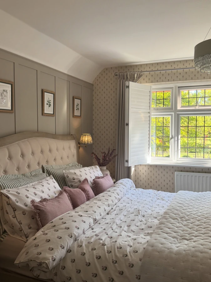 Tufted Headboard with Botanical Wallpaper and Panel Molding