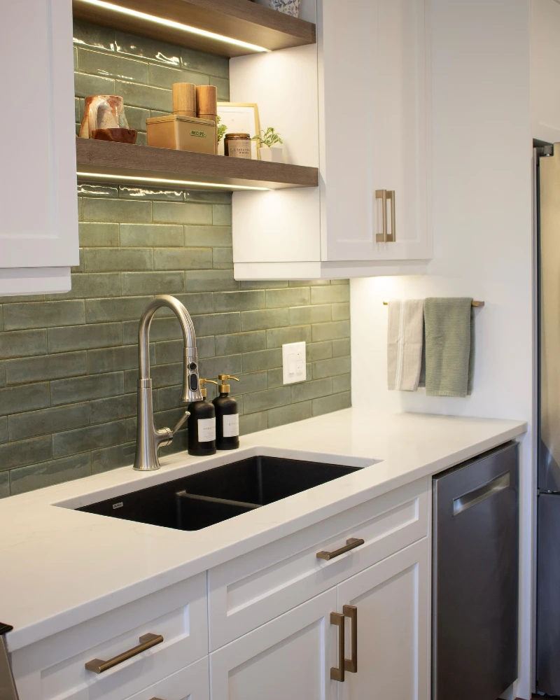 Under Cabinet LED Glow with Sage Green Subway Tile Backsplash and Floating Wood Shelves