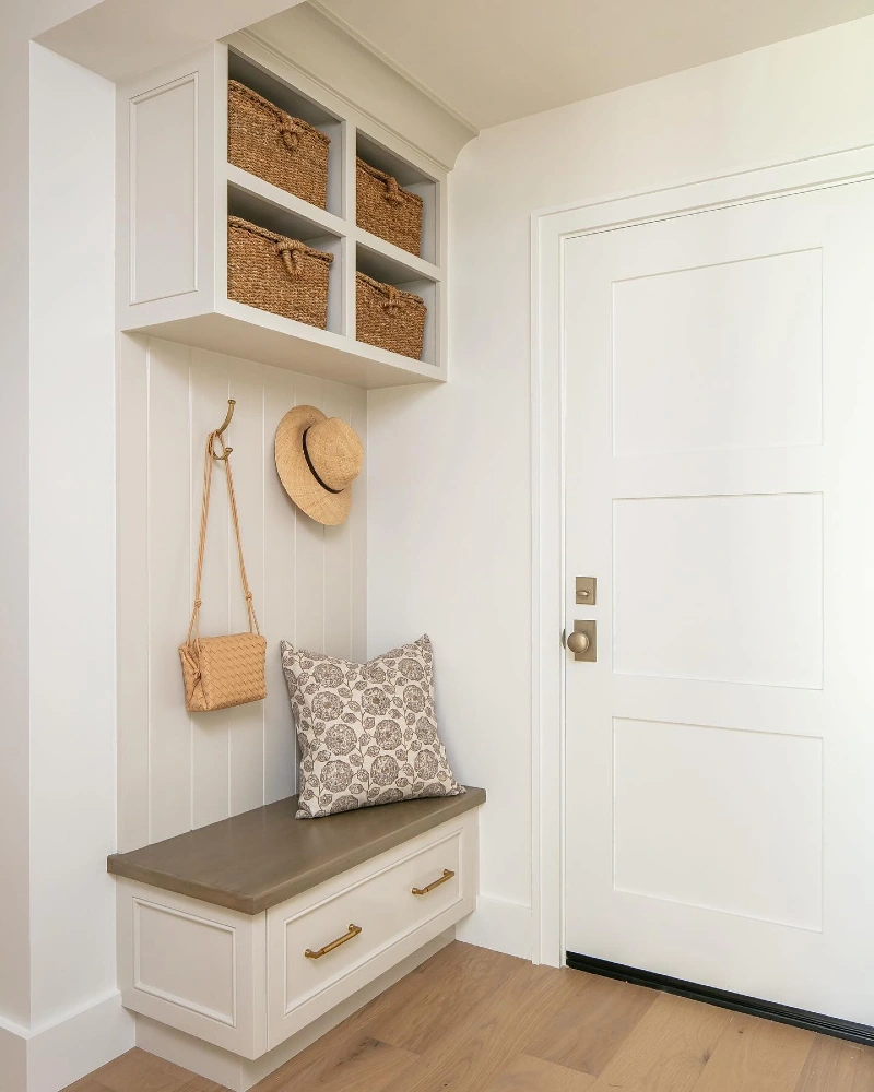 White Built-In Bench with Woven Baskets and Brass Hardware