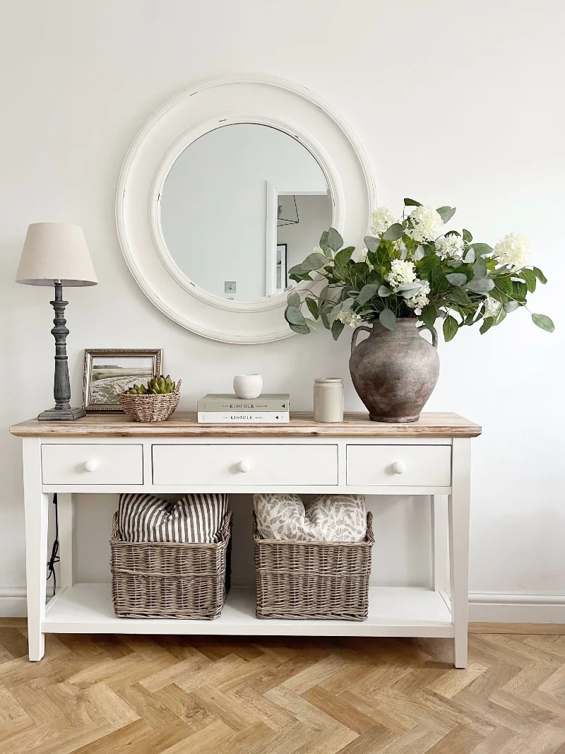 White Console with Round Mirror, Willow Baskets, and Full Eucalyptus Arrangement
