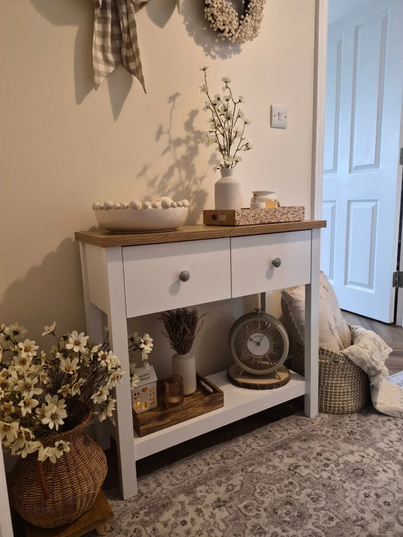 White Console with Wooden Top, Floral Tray, Clock Shelf, and Basket Flowers