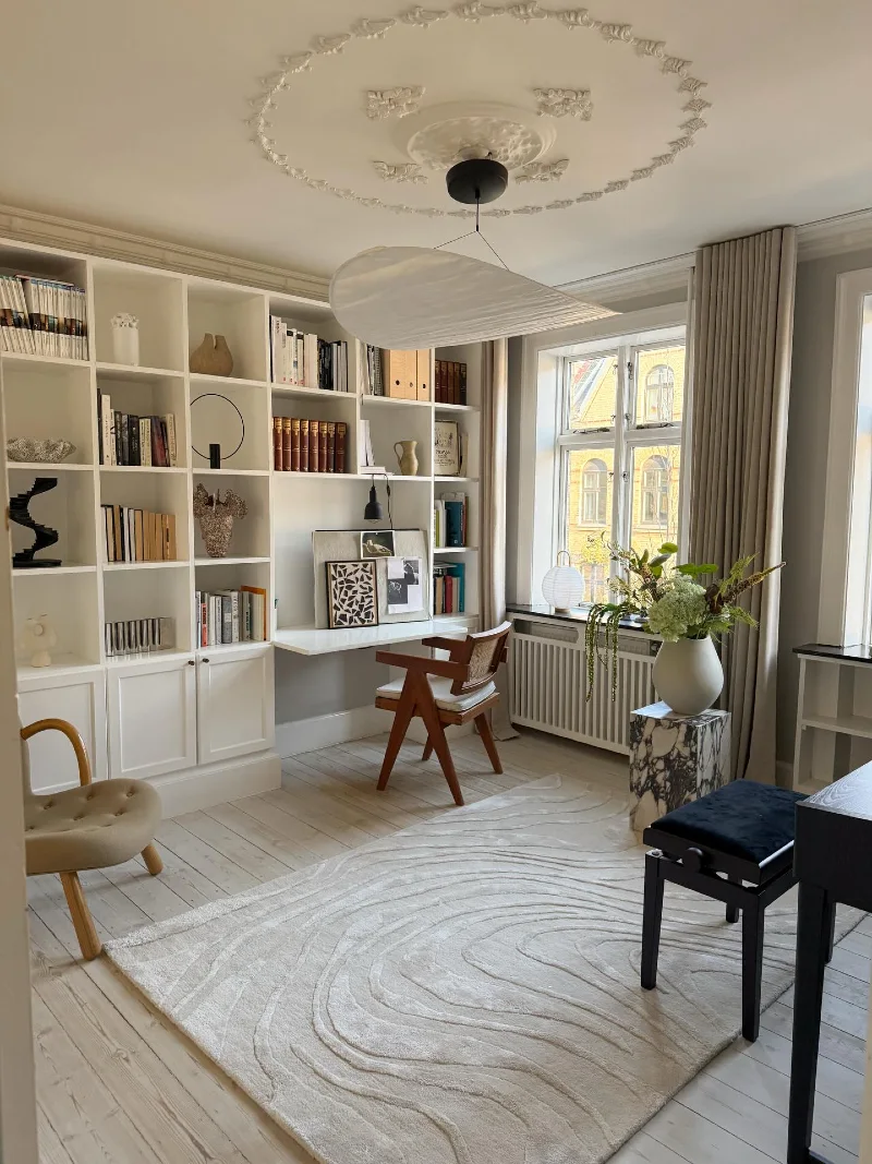 White Library Desk Wall with Sculptural Ceiling Rose and Wave Rug