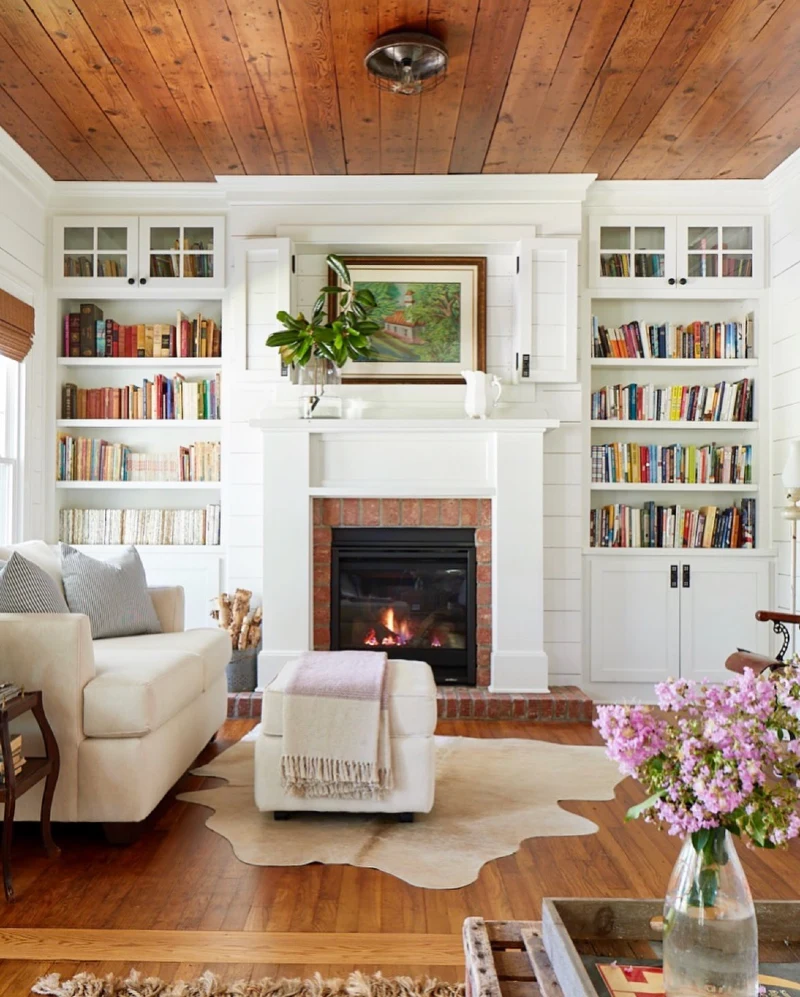 White Shiplap Mantel with Built In Bookcases, Landscape Art, and Glass Leaf Stems