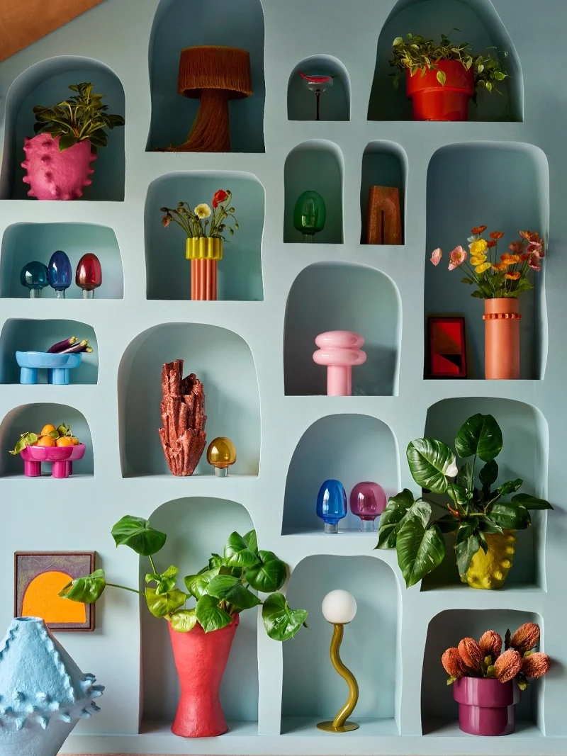 Arched Built-in Display Wall with Multi-Colored Ceramic and Glass Collectibles