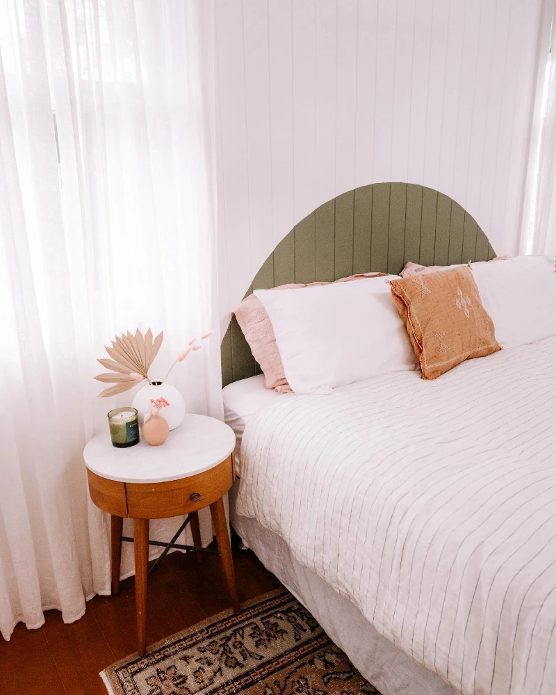 Arched Sage Green Slatted Headboard with Warm Earthy Accents
