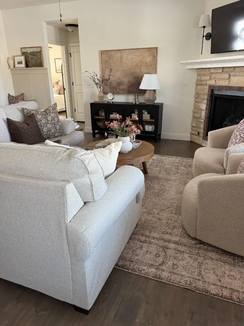 Black Arch-Glass Credenza with Oversized Brown Canvas and Stone Fireplace