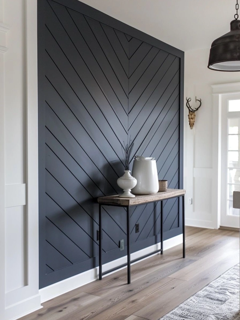 Black Chevron Slat Accent Wall with Slim Wood Console and White Ceramic Vases