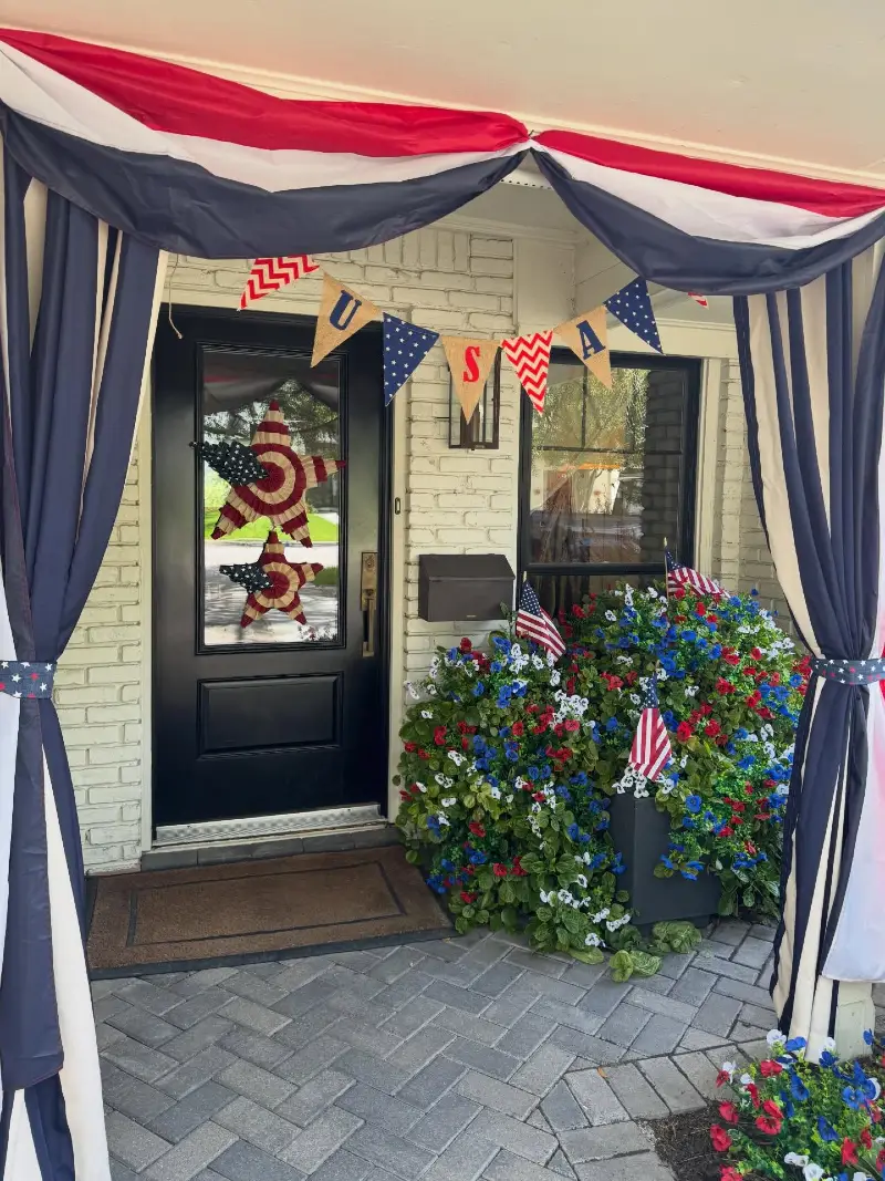 Black Front Door Framed by Fabric Drapes and Burlap USA Pennant Banner