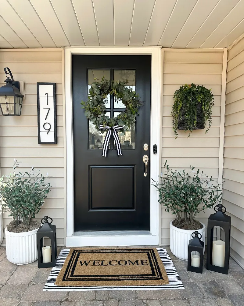 Black Front Door with Eucalyptus Wreath and Matching Olive Planters