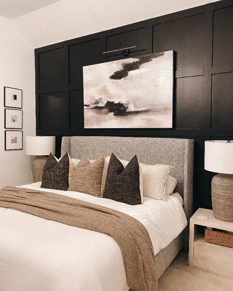 Black Square Grid Accent Wall with Oversized Abstract Art and Grey Linen Bed