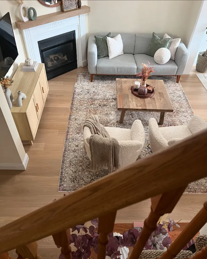 Blocky Wooden Coffee Table with Bouclé Swivel Chairs and Vintage Distressed Rug