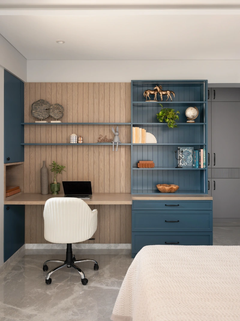 Blue Built In Shelving with Oak Slat Backdrop and Integrated Desk